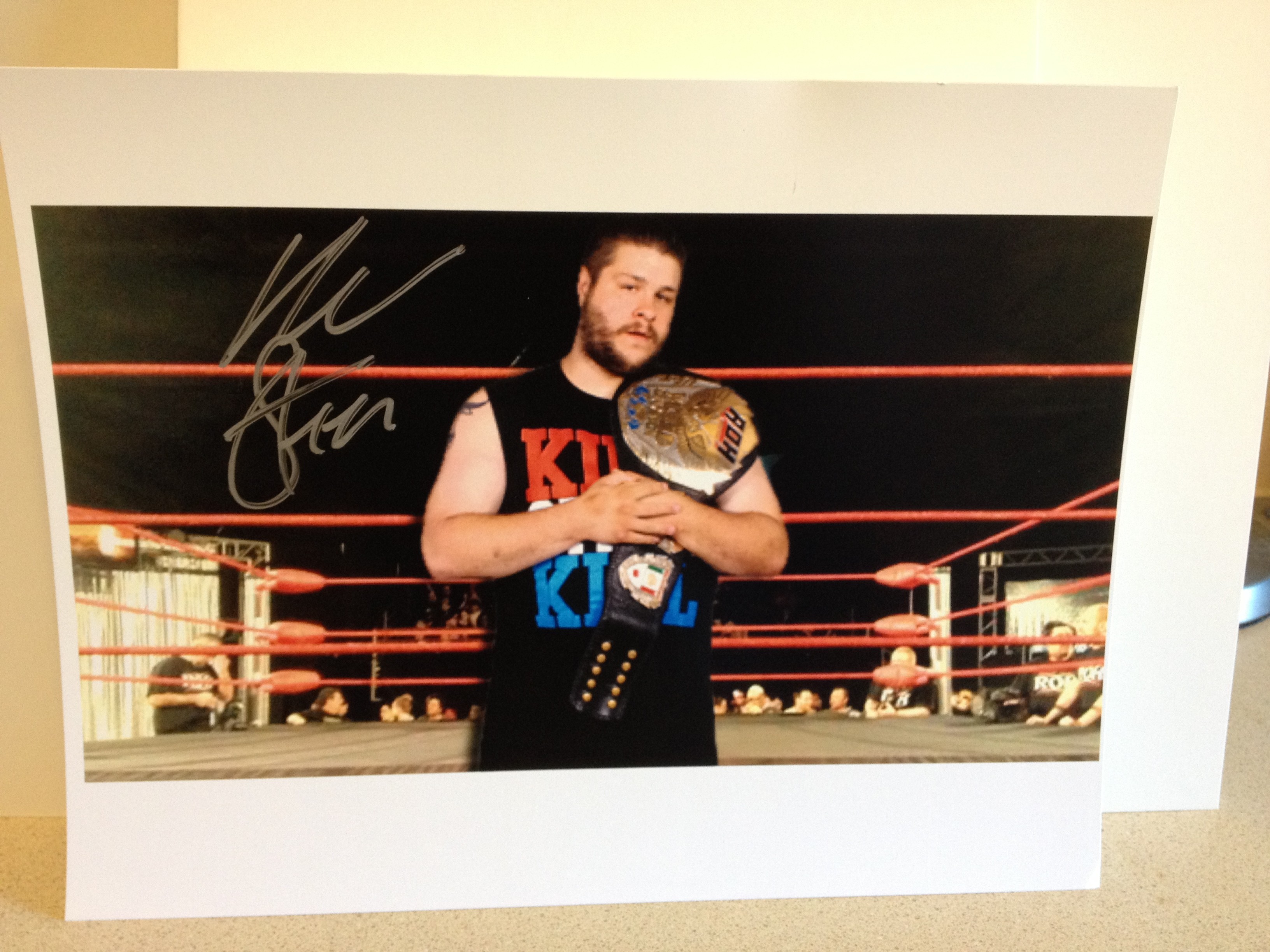 Kevin Steen Signed Color Photo w/Belt (100% Authentic) Comes w/Certificate of Authenticity